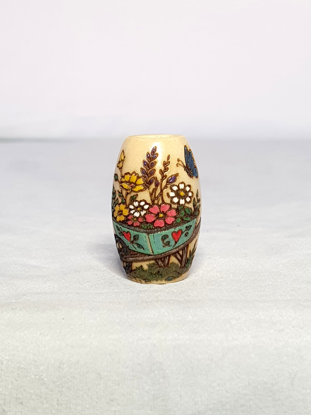 Springtime Wheelbarrow Bead – hand-painted floral wheelbarrow garden dreadlock wood bead